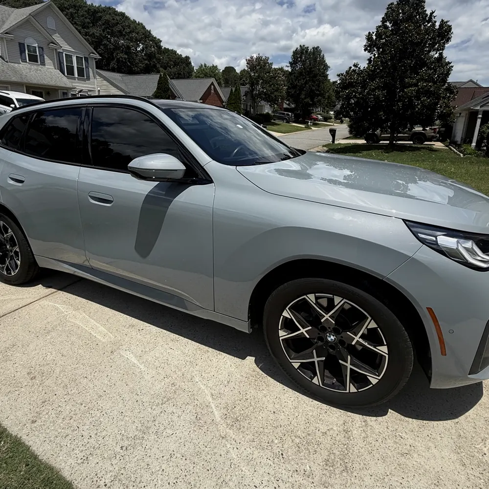 Grey BMW X1 with ceramic window tint, installed for a Greenville customer