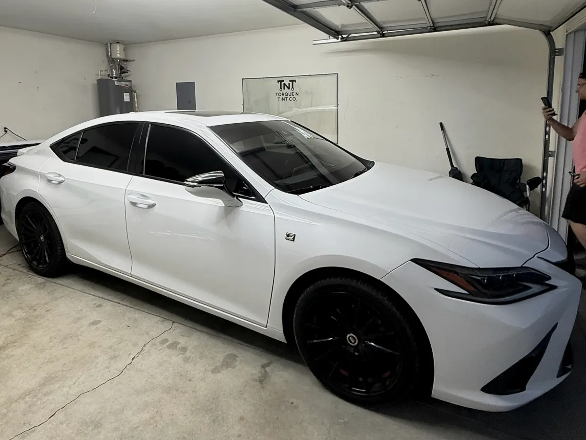 White Lexus ES F Sport tinted inside the Torque N Tint Co. shop