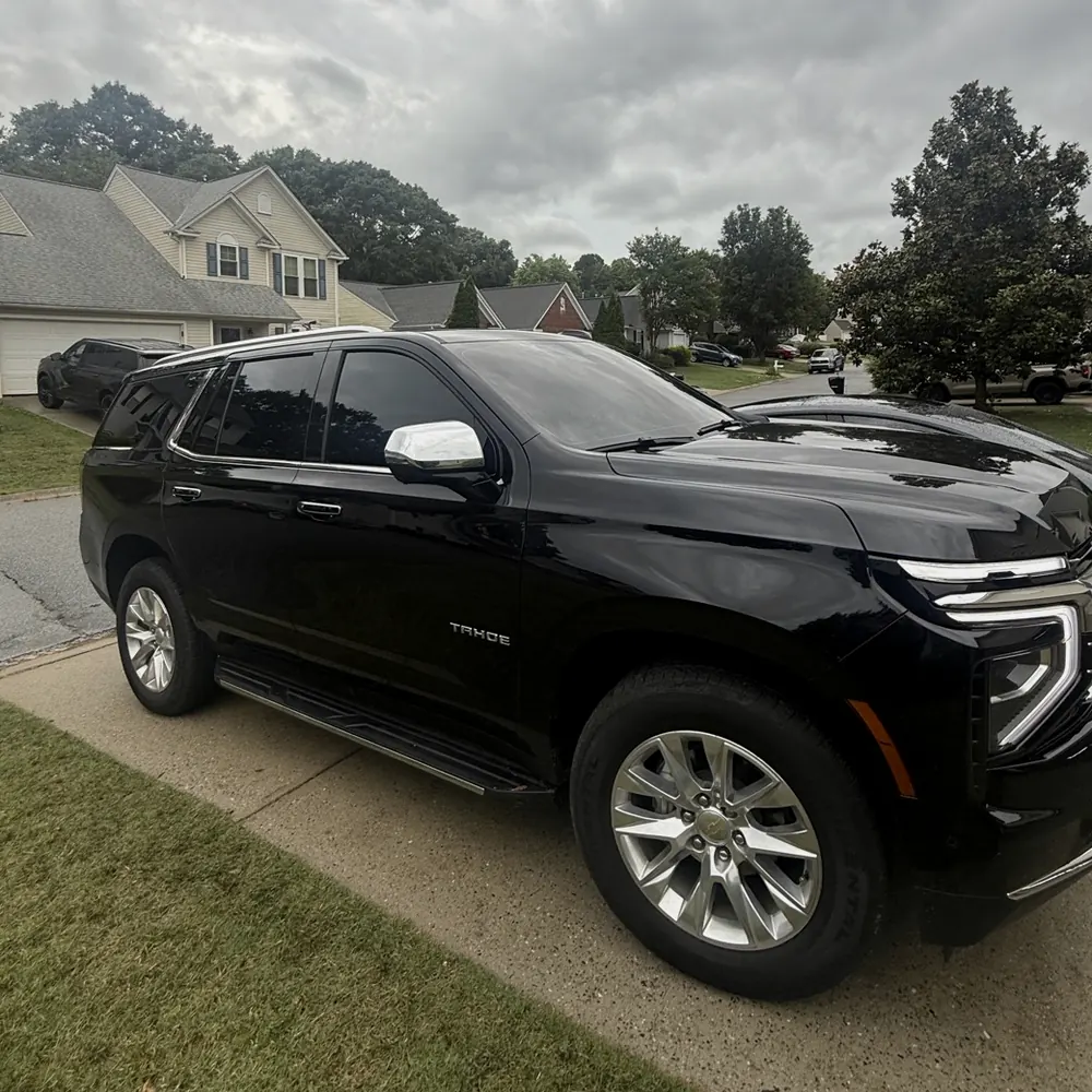 Black Chevrolet Tahoe with privacy tint, installed for a Mauldin customer