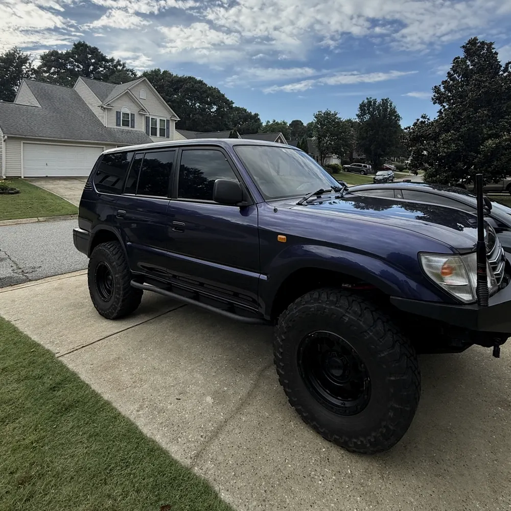 Lifted purple Toyota Land Cruiser with window tint, tinted for a Duncan customer